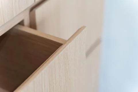 Close-up of a light woodgrain cabinet and its exposed finished edges